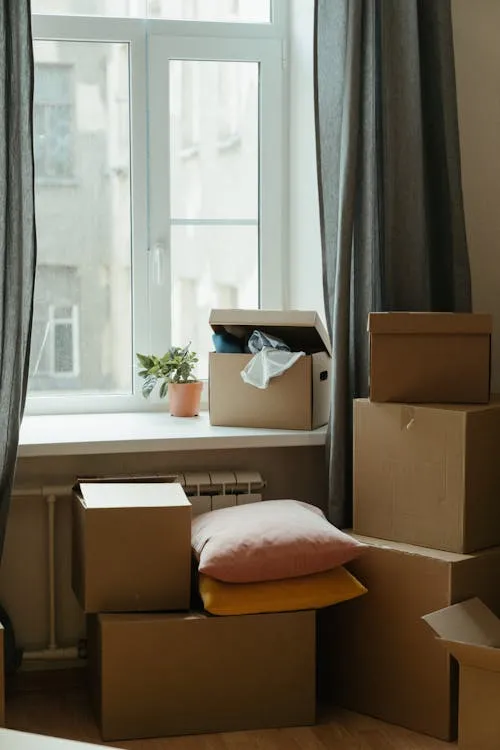 A calendar open on a table while someone chooses a date for their house move