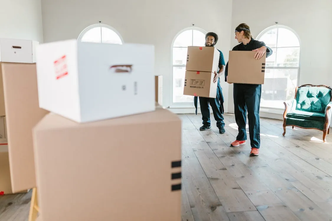 Homeowner checking a removalist quote and contract before paying a deposit