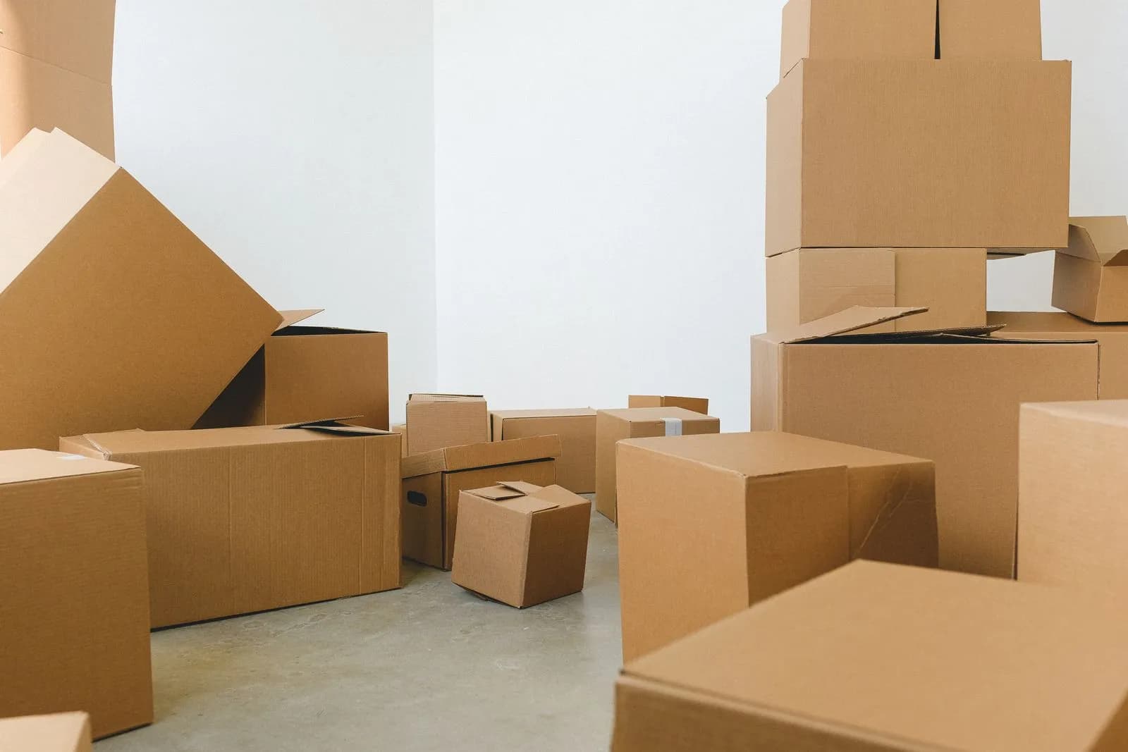 A pile of assorted cardboard moving boxes collected for a house move