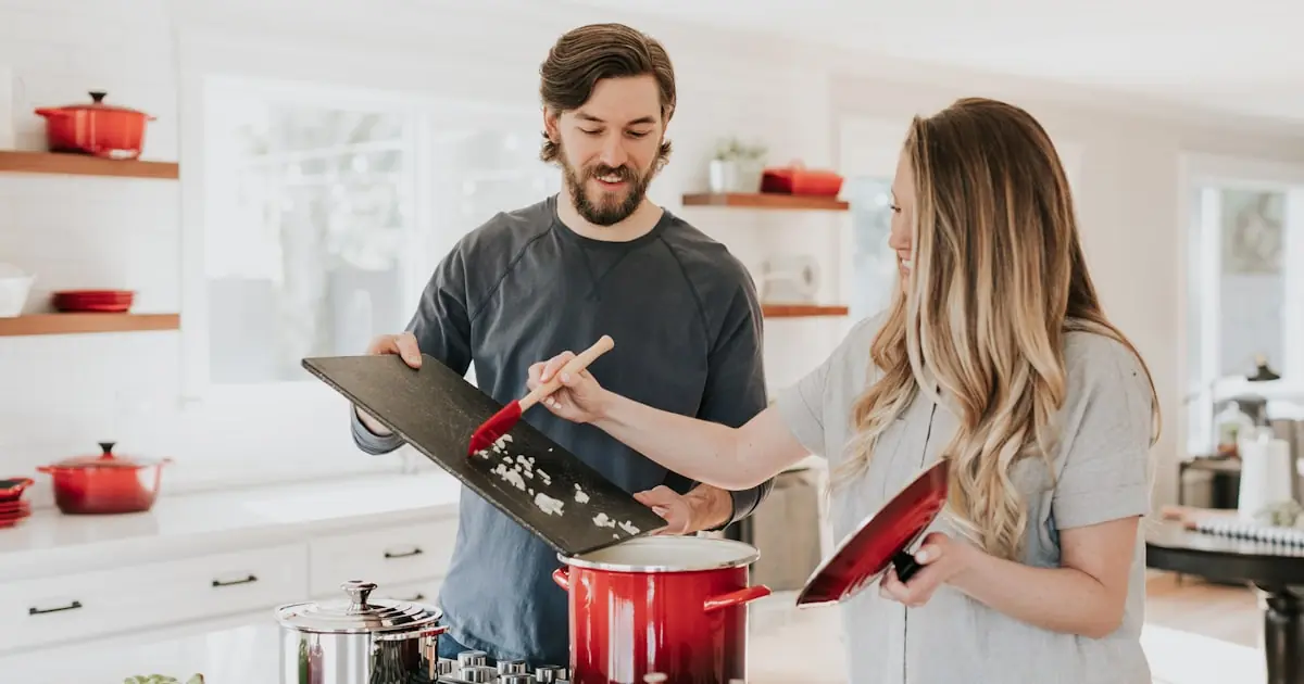 Kitchen packing tips, plates wrapped in packing paper and glassware safely boxed for a move