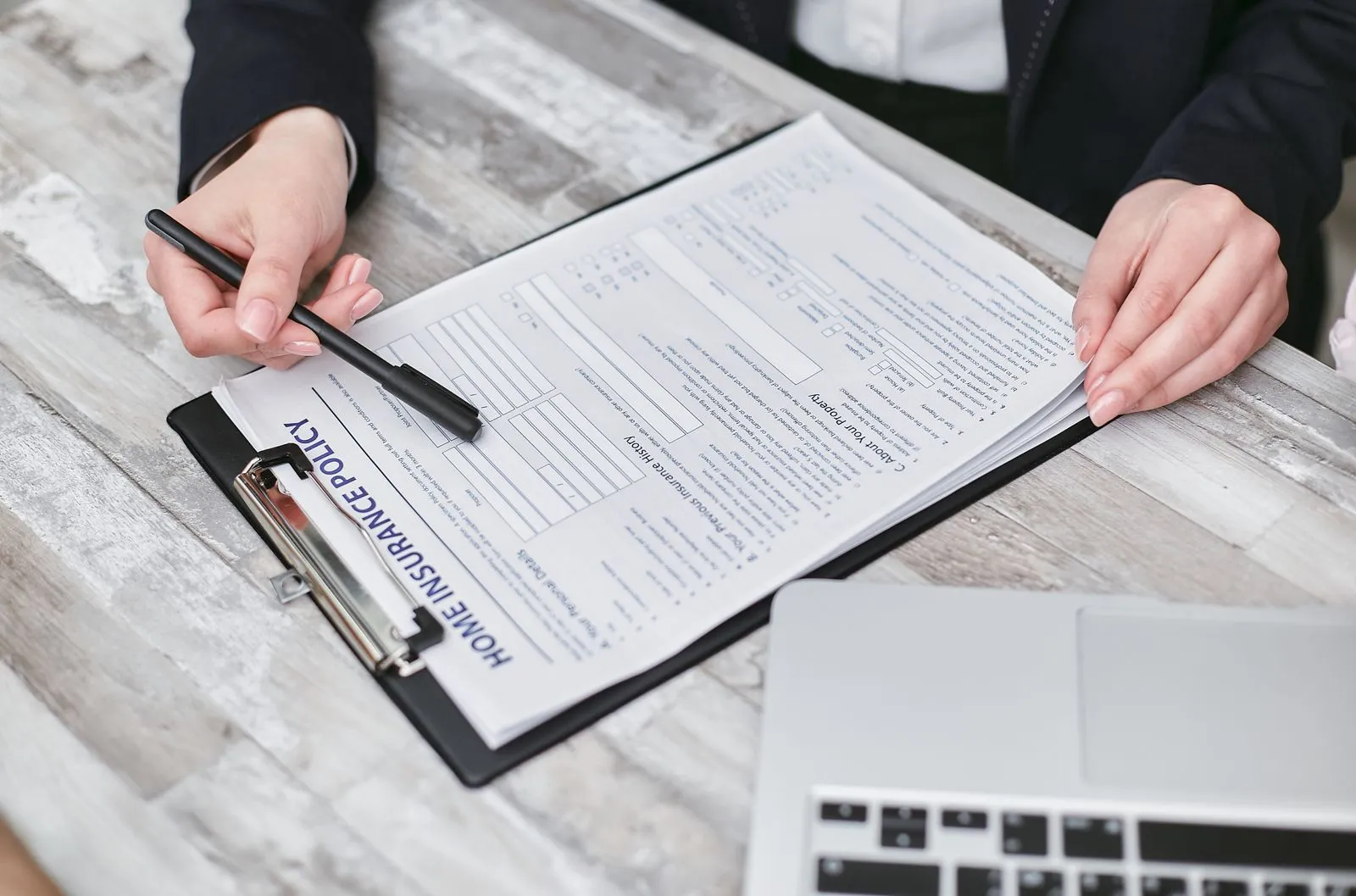 Reading and signing a removalist's insurance and liability paperwork before booking a move