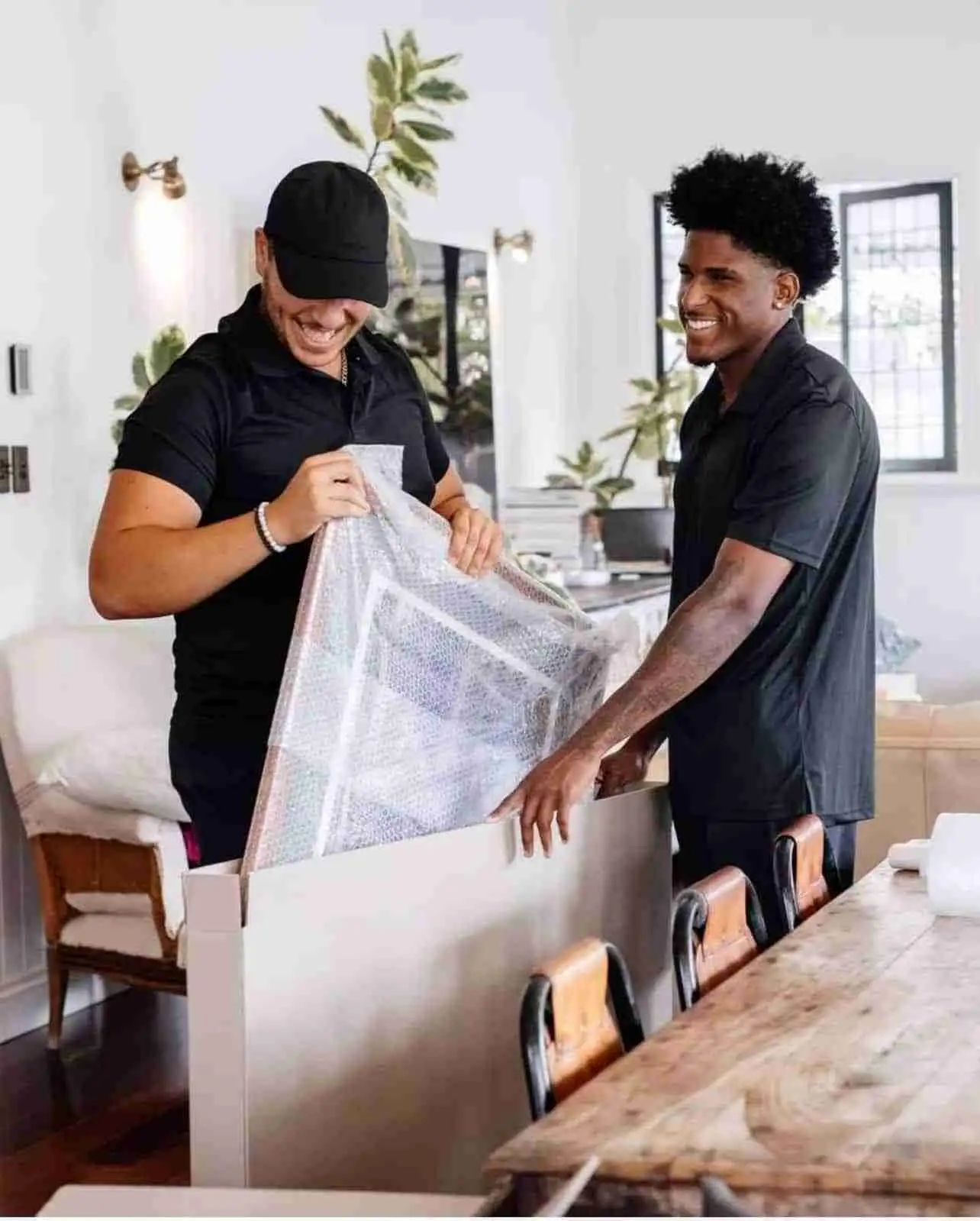 R2G professional packers carefully wrapping and boxing belongings for a Sunshine Coast move R2G professional packers carefully wrapping and boxing belongings for a Sunshine Coast move - R2G Packing Services Sunshine Coast